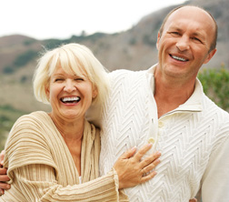 mature couple demonstrates beautiful evanston dentures